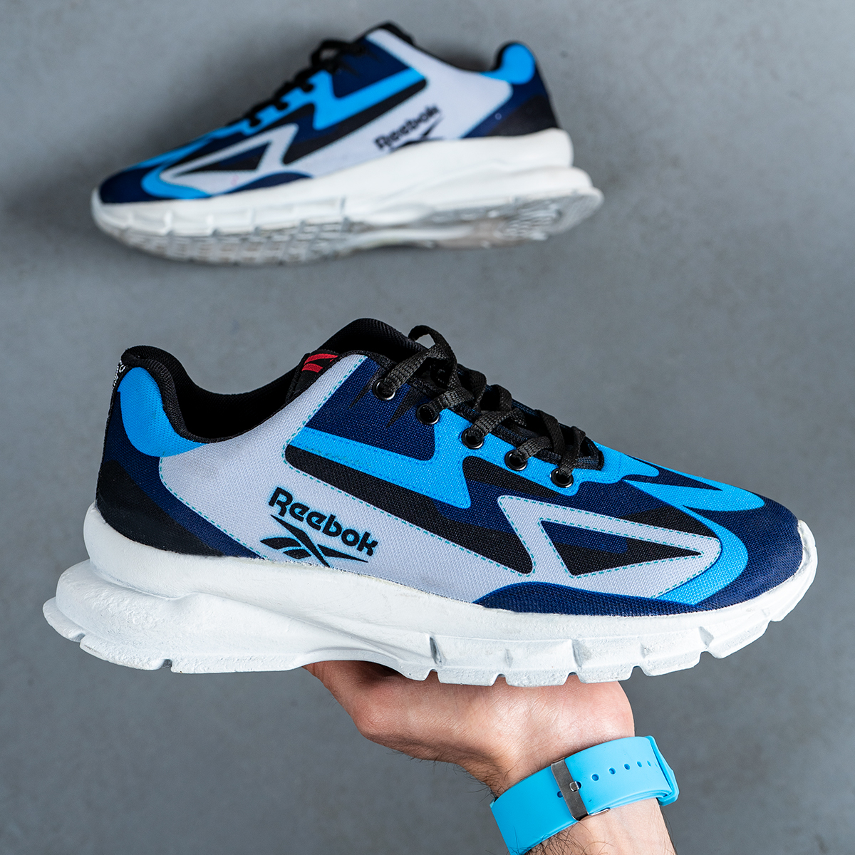 کفش ورزشی ریبوک آبی طوسی مردانه مدل Ervan