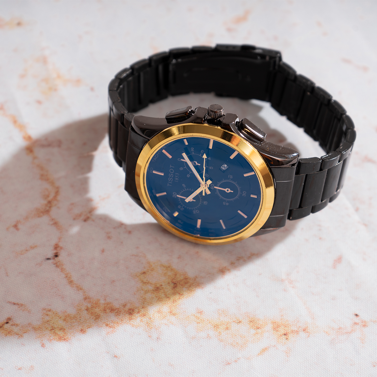 ساعت مچی مردانه مشکی طلایی صفحه آبی مدل Tissot